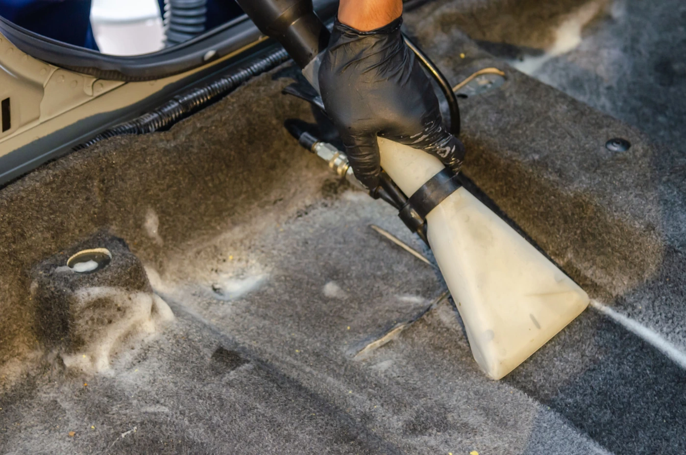 Professional carpet extractor lifting dirt from a carpet